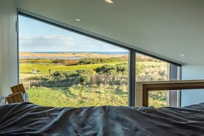 The bedroom has incredible views over the coast.