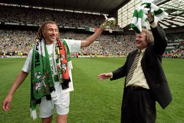 Henrik Larsson celebrates winning the championship alongside Celtic manager Wim Jansen after a 2-0 win over St Johnstone on May 9, 1998.