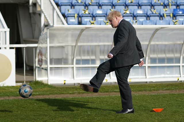 Prime Minister Boris Johnson on Friday, kicking a football during a visit to Hartlepool United Football Club ahead of the May 6 by-election. Picture: Press Association