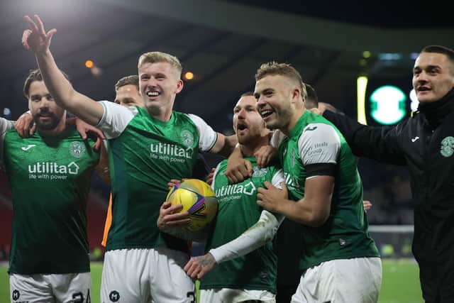 The Hibs players celebrate with their fans after the 3-1 win over Rangers at Hampden.