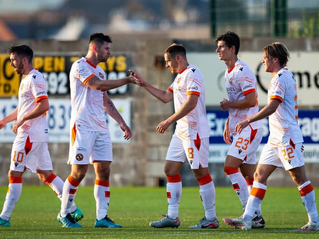 Dundee United celebrate Peter Pawlett's goal.