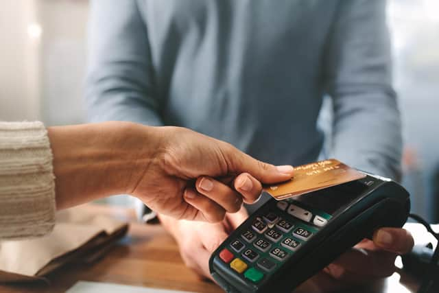 A woman purchasing products in the pharmacy using contactless. PIC: Jacob Lund - stock.adobe.com