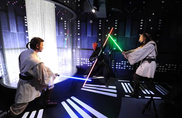 Immortalised in wax: Jedi knights Obi-Wan Kenobi, left, and Qui Gon Yin take on Darth Maul at Madame Tussauds (Picture: Stuart C Wilson/Getty Images)