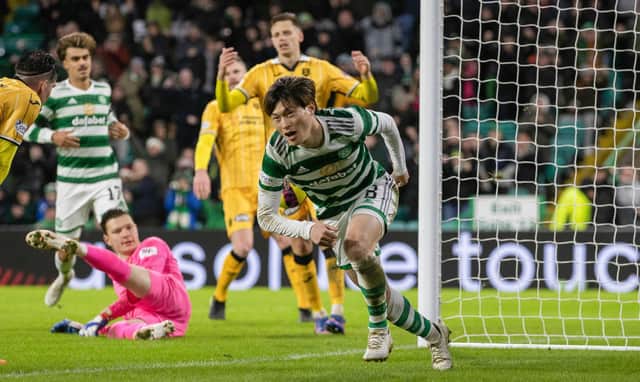 Kyogo Furuhashi celebrates after scoring what proved to be Celtic's winner against Livingston. (Photo by Craig Williamson / SNS Group)