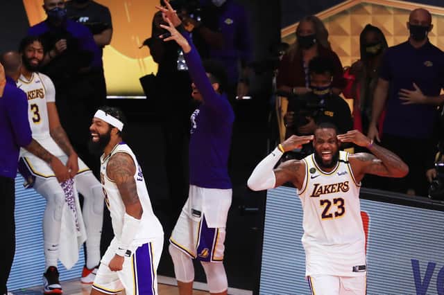 LeBron James (No 23) of the Los Angeles Lakers reacts after winning the 2020 NBA Championship over the Miami Heat in Game Six of the 2020 NBA Finals.