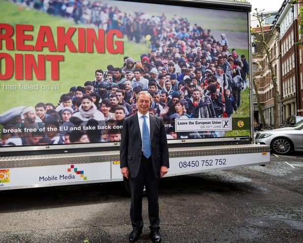 Nigel Farage poses with a highly controversial Ukip campaign poster ahead of the 2016 Brexit referendum (Picture: Jack Taylor/Getty Images)
