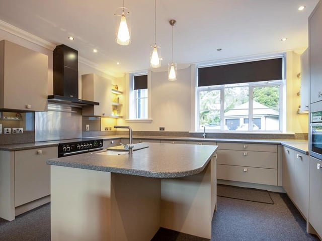 The luxurious dining kitchen has the added benefit of a large central island.