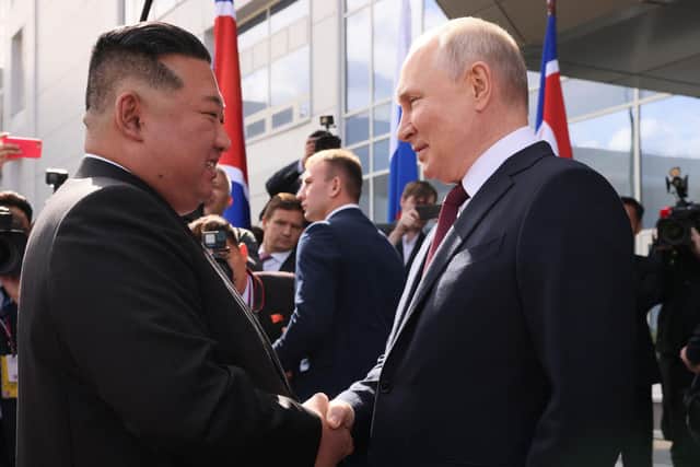Russian president Vladimir Putin (right) shakes hands with North Korea's leader Kim Jong-Un (left) during their meeting at the Vostochny Cosmodrome. Picture: Mikhail Metzel/AFP via Getty Images