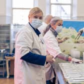 Volunteers and staff at Empty Kitchens Full Hearts, a charity set up during the first Covid-19 lockdown in 2020, prepare meals for delivery to people in need around Edinburgh. Picture: Scott Barron