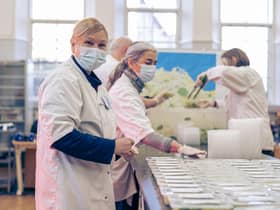Volunteers and staff at Empty Kitchens Full Hearts, a charity set up during the first Covid-19 lockdown in 2020, prepare meals for delivery to people in need around Edinburgh. Picture: Scott Barron