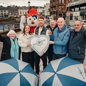 TV presenter Sean Batty and STP's Kimberley Guthrie celebrating Oban's 2024 Town of the Year win with community leaders