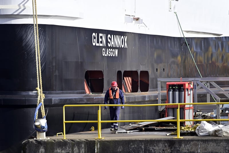 A worker next to the Glen Sannox as the ferry is prepared to sail. Picture: John Devlin