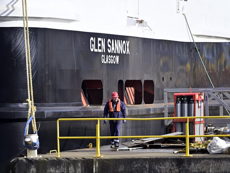 A worker next to the Glen Sannox as the ferry is prepared to sail. Picture: John Devlin