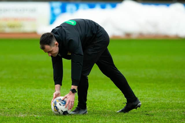 Referee Don Robertson calls the Dundee v Rangers match off during a secondary pitch inspection. (Photo by Ewan Bootman / SNS Group)