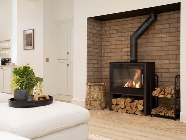 Log burning stove in living room.