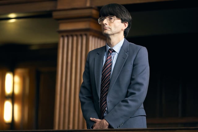 In a scene from Des, David Tennant portrays Dennis Nilsen during his trial for murder.