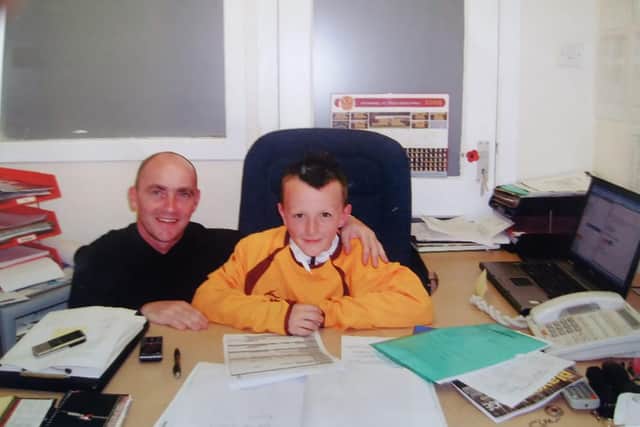 Gordon Young with a young David Turnbull signing on at Motherwell.