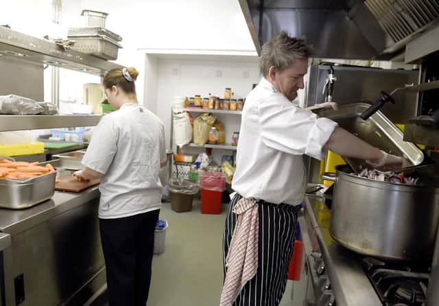 Empty Kitchens, Full Hearts team preparing meals to hand out