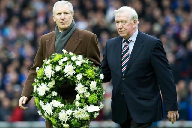 John Greig joined by his friend and former Old Firm rival, the late Celtic captain Billy McNeill, when they helped mark the 40th anniversary of the Ibrox Disaster in 2011. (Photo by Craig Williamson/SNS Group).