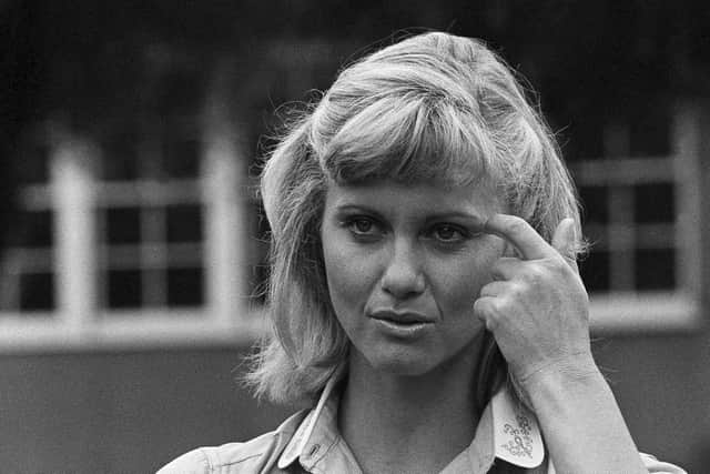 Actress and singer Olivia Newton-John appears on the set of Grease, in Los Angeles, in 1977. Picture: AP Photo/Nick Ut, File