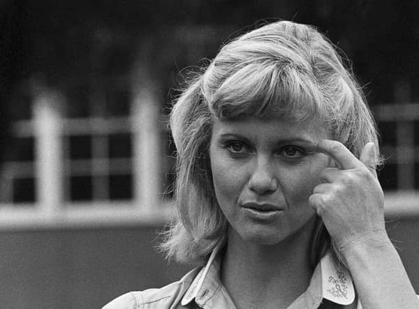 Actress and singer Olivia Newton-John appears on the set of Grease, in Los Angeles, in 1977. Picture: AP Photo/Nick Ut, File
