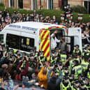 Lakhvir Singh and Sumit Sehdev are released from the back of an Immigration Enforcement van after last Thursday's failed Home Office raid. (Picture credit: Andrew Milligan/PA)