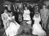 Seven couples getting married at the Gretna Green Smithy's Anvil on Valentine's Day 1989.