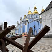 A woman leaves the Mykhailo Golden Domes Cathedral in Kyiv after a service for Ukrainians who have died as a result of the Russian invasion (Picture: Sergei Supinsky/AFP via Getty Images)