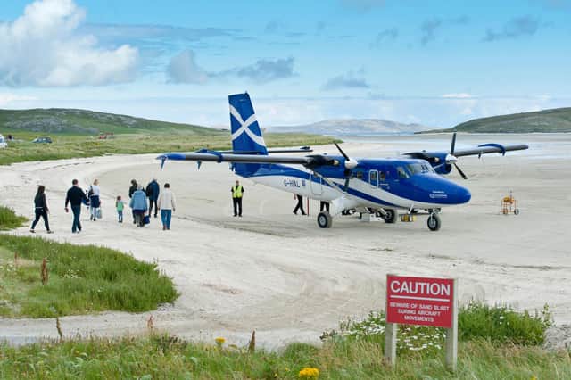 Planes flying into the island of Barra famously land on the beach (Picture: Stefan Auth/imageBROKER/Shutterstock)