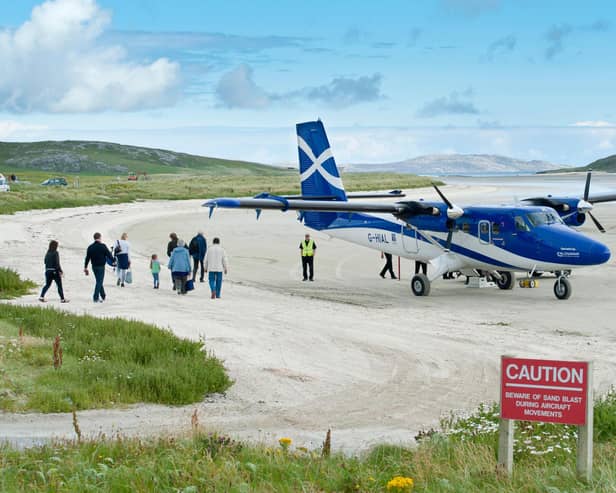 Planes flying into the island of Barra famously land on the beach (Picture: Stefan Auth/imageBROKER/Shutterstock)