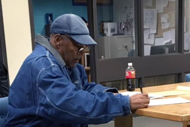 OJ Simpson signs paperwork before his release from prison in Lovelock, Nevada, in 2017 after serving nine years for armed robbery, kidnapping, and other charges (Picture: Brooke Keast/Nevada Department of Corrections via Getty Images)