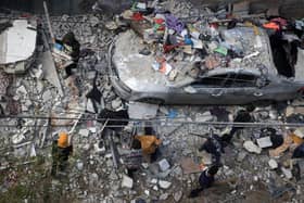 People assess the damage caused by Israeli bombardment in Rafah in the southern Gaza Strip as battles continue between Israel and the Palestinian Hamas movement. Picture: Mahmud Hams/AFP via Getty Images