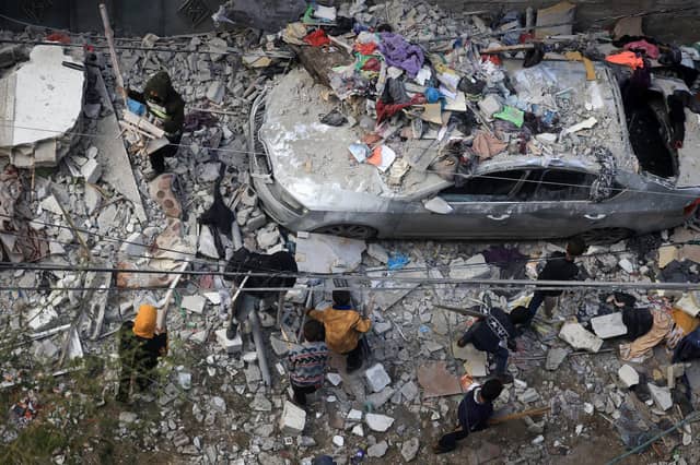 People assess the damage caused by Israeli bombardment in Rafah in the southern Gaza Strip as battles continue between Israel and the Palestinian Hamas movement. Picture: Mahmud Hams/AFP via Getty Images