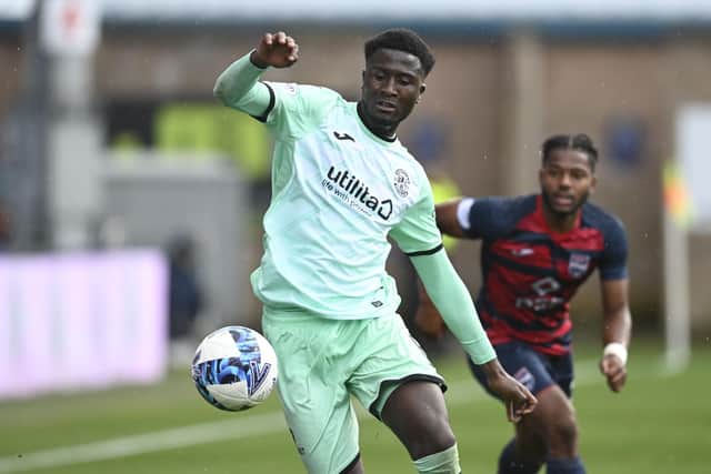 Hibs' Nohan Kenneh has joined Ross County on loan for the rest of the season.