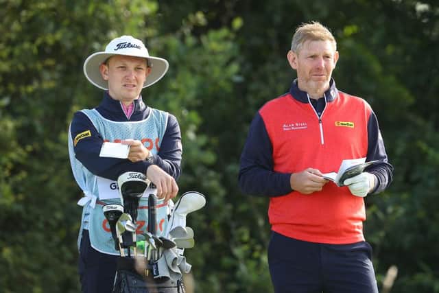 Stephen Gallacher talks tactics with son/caddie Jack during the Cazoo Classic at London Golf Club in August. Picture: Andrew Redington/Getty Images.