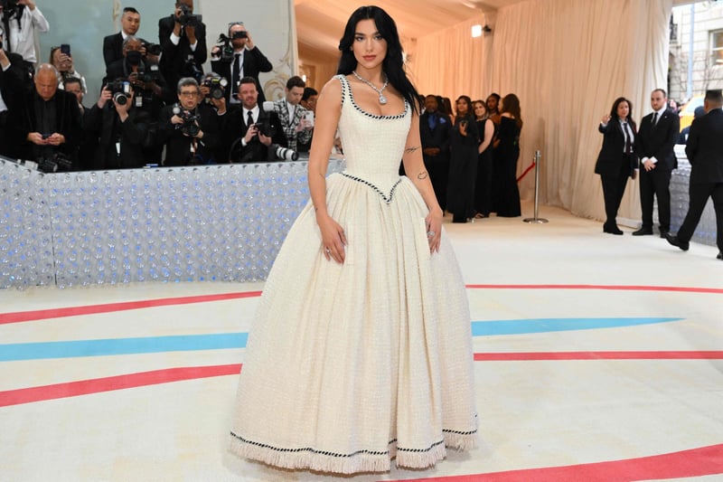 Dua Lipa, one of the event's co-chairs, at the 2023 Met Gala in a tweed Chanel wedding dress originally worn by Claudia Schiffer in 1992.