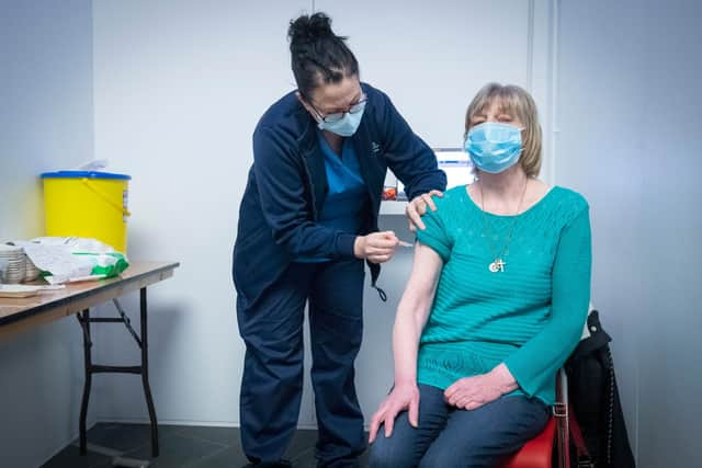 Nurse Sarah MacLeod, from the Vaccination Team, gives Margaret Swift, aged 69, from Balgreen, Edinburgh, her vaccine at the coronavirus mass vaccine centre at the Edinburgh International Conference Centre  on February 1, 2021 in Edinburgh. Photo by Jane Barlow - Pool/Getty Images