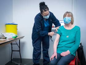 Nurse Sarah MacLeod, from the Vaccination Team, gives Margaret Swift, aged 69, from Balgreen, Edinburgh, her vaccine at the coronavirus mass vaccine centre at the Edinburgh International Conference Centre  on February 1, 2021 in Edinburgh. Photo by Jane Barlow - Pool/Getty Images