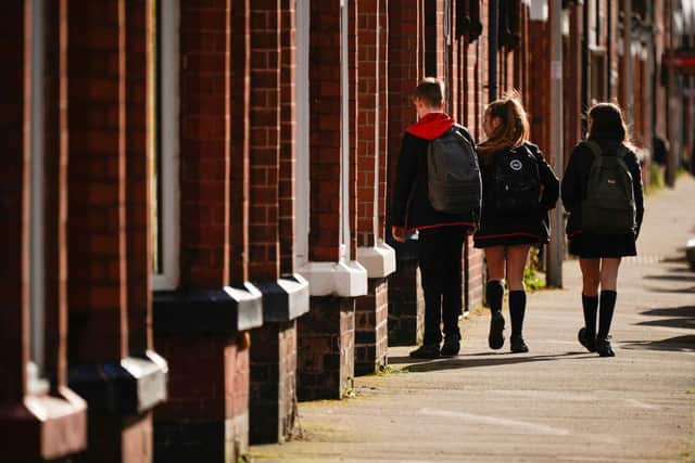Schoolchildren head home as schools are closed due to the ongoing coronavirus pandemic. Picture: Christopher Furlong/Getty Images