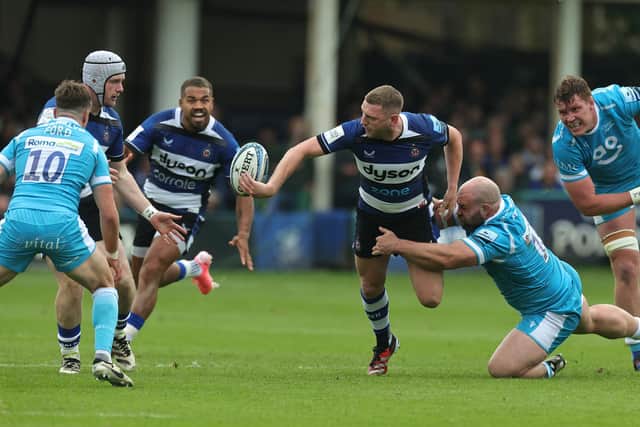 Finn Russell of Bath offloads during the Gallagher Premiership Rugby play-off semi-final against Sale Sharks at the Recreation Ground. (Photo by David Rogers/Getty Images)