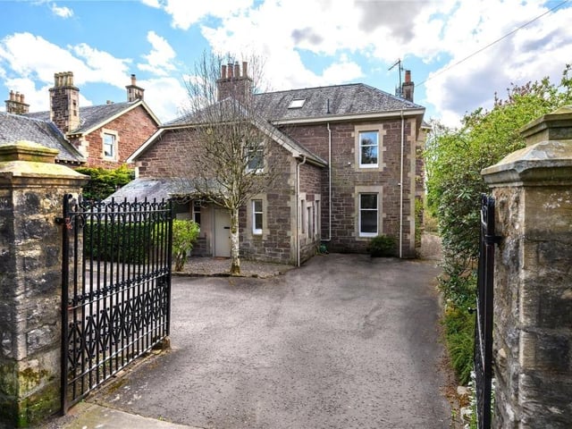 Gated entrance and rear of property.
