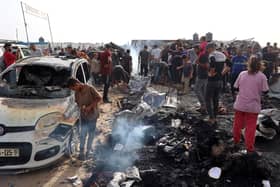 Palestinians gather at the site of an Israeli strike on a camp for internally displaced people in Rafah. Picture: Eyad Baba/AFP via Getty Images