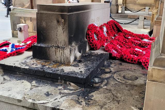 Wreaths laid at the Edinburgh City Chambers war memorial were set on fire