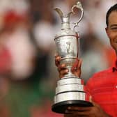 Tiger Woods poses with the Claret Jug after winning the 135th Open Golf at Royal Liverpool in 2006. Picture: John D McHugh/AFP via Getty Images.