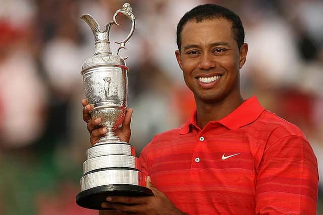 Tiger Woods poses with the Claret Jug after winning the 135th Open Golf at Royal Liverpool in 2006. Picture: John D McHugh/AFP via Getty Images.