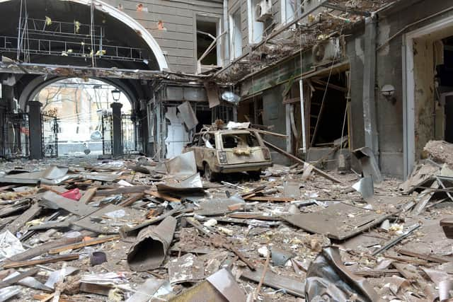 A picture shows damages in a building entrance after the shelling by Russian forces of Constitution Square in Kharkiv, Ukraine's second-biggest city, on March 2, 2022. - On the seventh day of fighting in Ukraine on March 2, Russia claims control of the southern port city of Kherson, street battles rage in Ukraine's second-biggest city Kharkiv, and Kyiv braces for a feared Russian assault. (Photo by Sergey BOBOK / AFP) (Photo by SERGEY BOBOK/AFP via Getty Images)