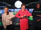 Scotland's First Minister Nicola Sturgeon poses for a photograph during her meeting with climate activists Vanessa Nakate (R) and Greta Thunberg during the COP26 UN Climate Change Conference.