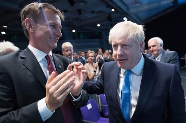 Jeremy Hunt, seen applauding Boris Johnson in 2019,  is chair of the Commons' Health and Social Care Committee (Picture: Stefan Rousseau/WPA pool/Getty Images)