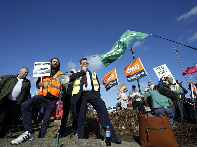 Labour MP for Kingston upon Hull East, Karl Turner (centre) speaks to protesters outside the Port of Hull,. Downing Street has said ministers have asked the Insolvency Service to investigate whether P&O complied with the notification requirements before making staff redundant.