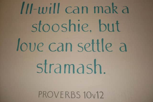 This example of the Scots language translates to: "Ill-will can make a row (squabble), but love can settle a fight (uproar)."